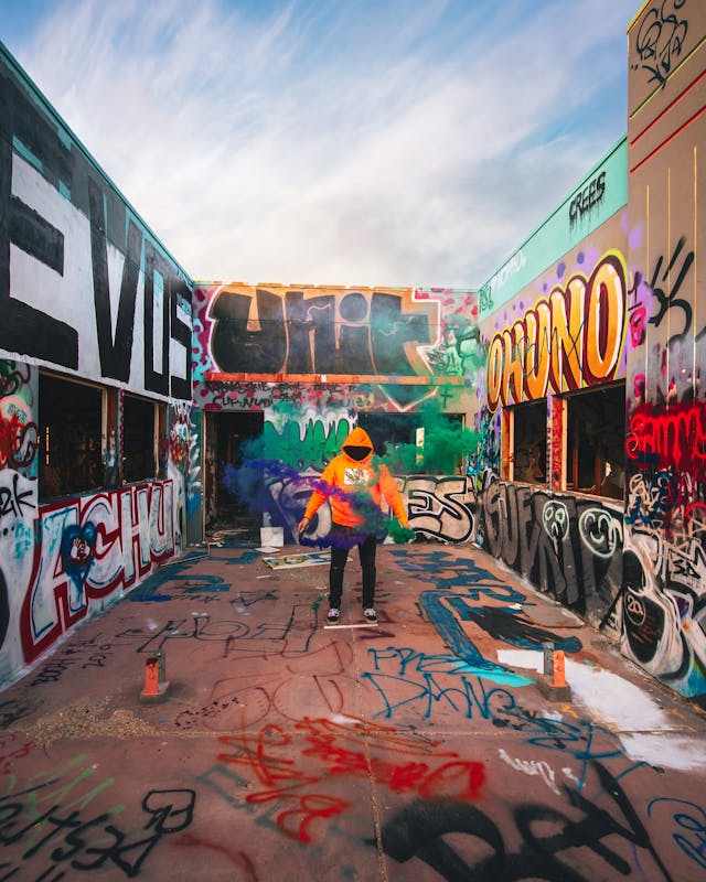 Man standing around graffiti